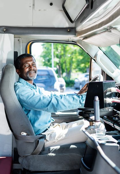 Depositphotos_208875082_S African American Driver smiling to welcome rider